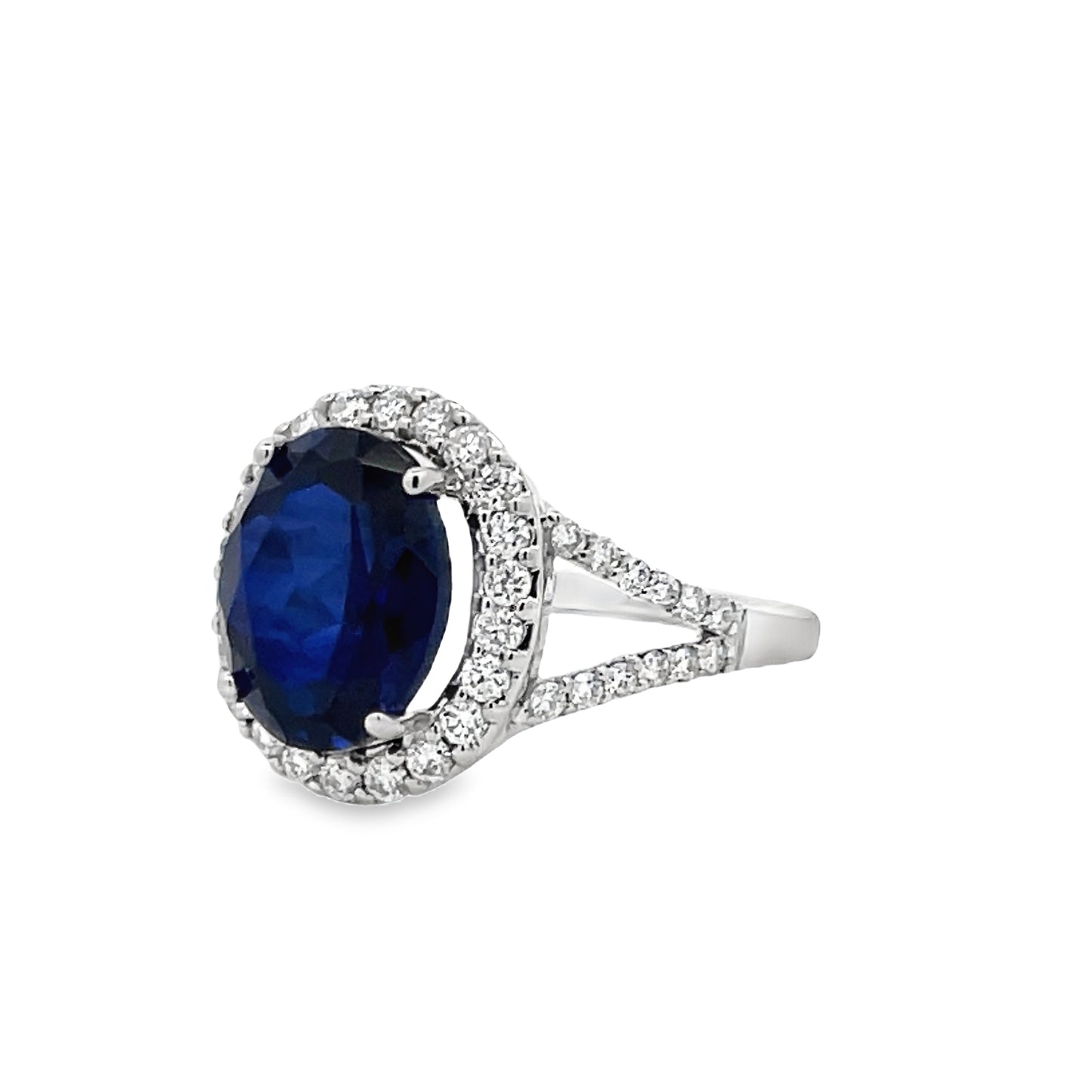 Side view of Oval Shape Blue Faceted Sapphire and Diamond Ring