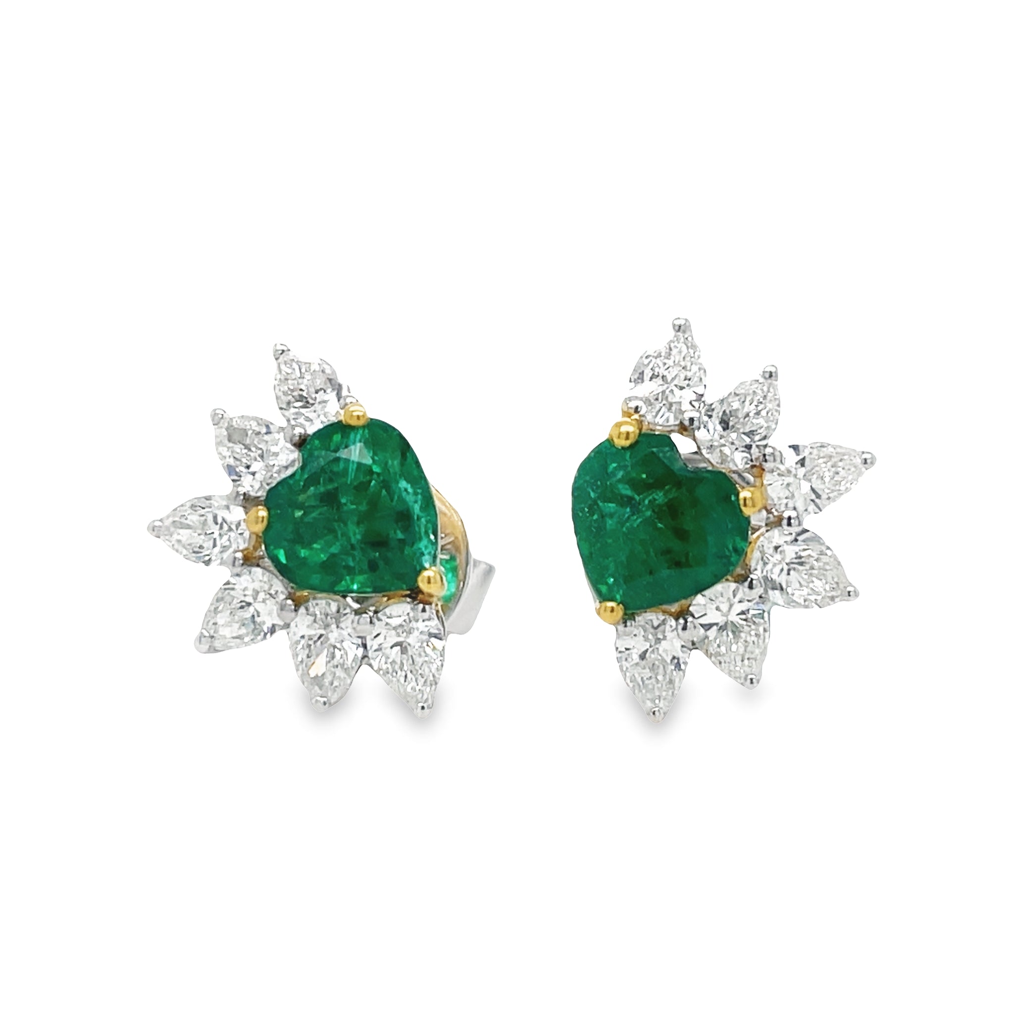 These Zambian Emerald and Marquise Diamond Stud Earrings feature a 1.33 cts heart shape cut emerald in 18k white and yellow gold, complimented by 12 marquise shape diamonds 1.02 cts. This elegant earring set is perfect for those looking to add the perfect combination of sparkle and sophistication to their look.