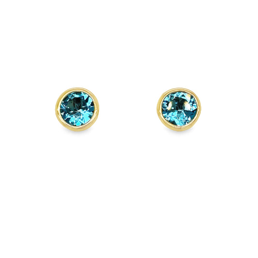 Front view of 18k Yellow Gold Blue Topaz Stud Earrings