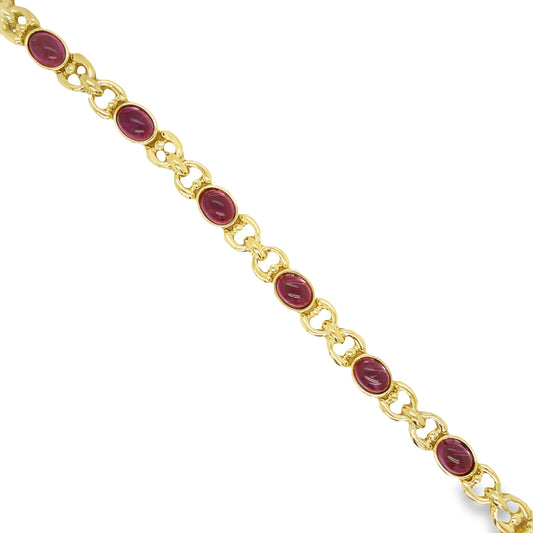 Top view of 18k Yellow Gold Pink Tourmaline Oval Cabochon Bracelet