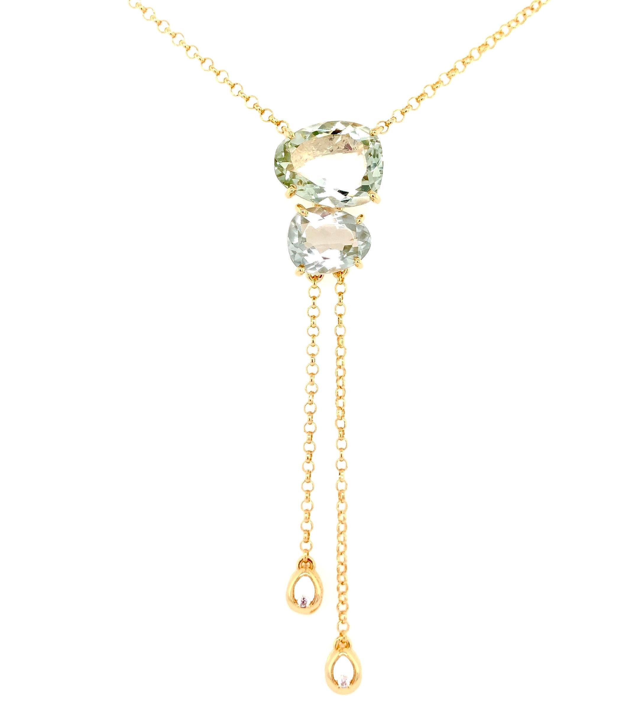 Indulge in luxury with our Brazilian made lariat necklace. Crafted from 18k yellow gold, this stunning piece features 6.80 cts of prazolite gems and 0.06 cts of round diamonds. The secure lobster catch ensures both beauty and functionality. Elevate your style with this exclusive and sophisticated necklace.