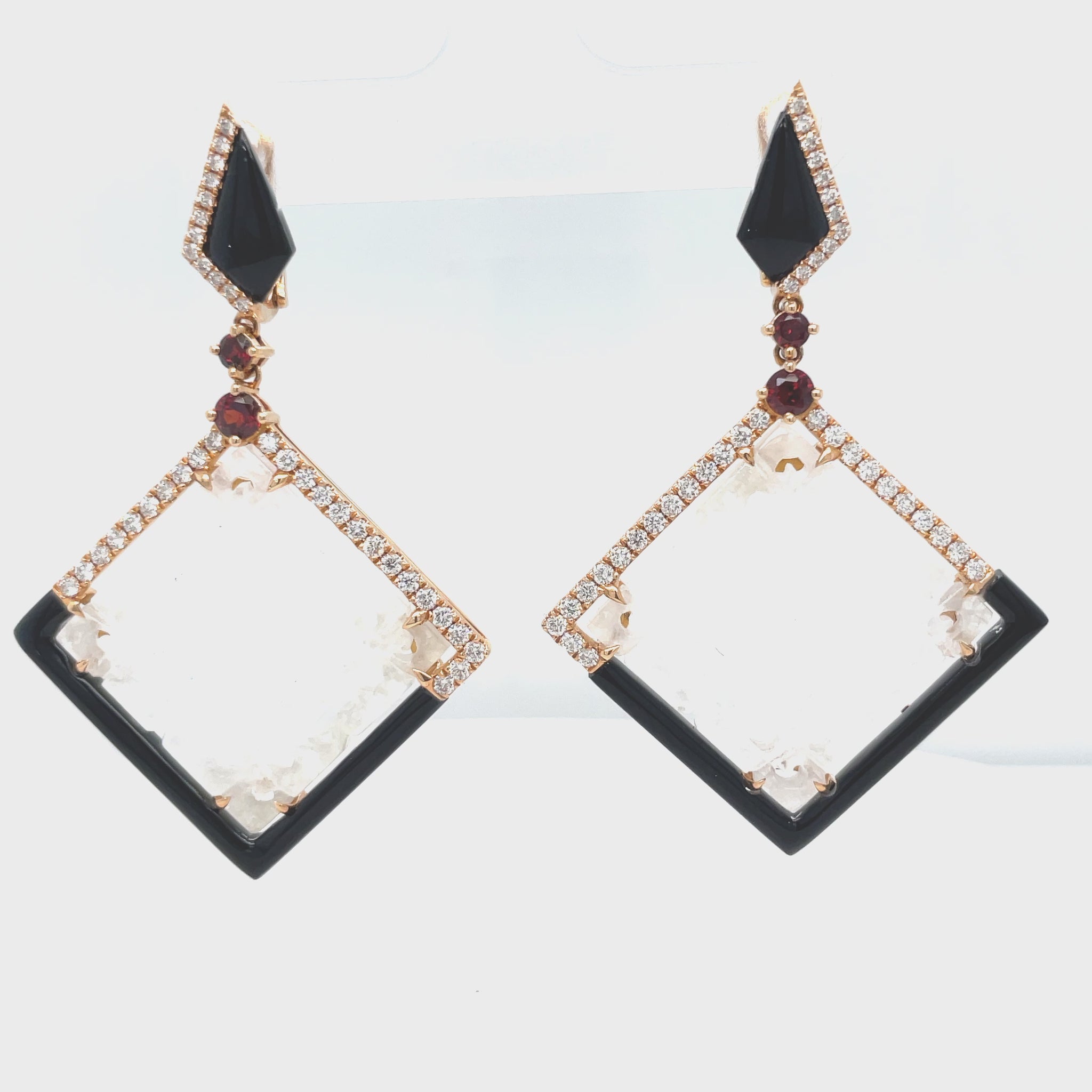 Look radiant wearing our stunning Unique Ice Jade, Diamond, Onyx & Garnet Drop Earrings! Luxurious 18k rose gold frames these rare ice jade stones, perfectly set with 0.79 cts of round diamonds, 6.21 cts of handmade onyx stripes, and four cabochon garnets. Get ready to shine!