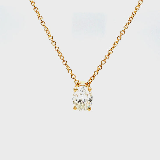 Indulge in understated luxury with our Oval Cut Diamond Solitaire Yellow Gold Necklace. The 1.20 carat oval cut diamond is elegantly set in a secure prong setting, suspended on a 16" yellow gold chain. Perfect for any occasion, this necklace exudes sophistication and grace.