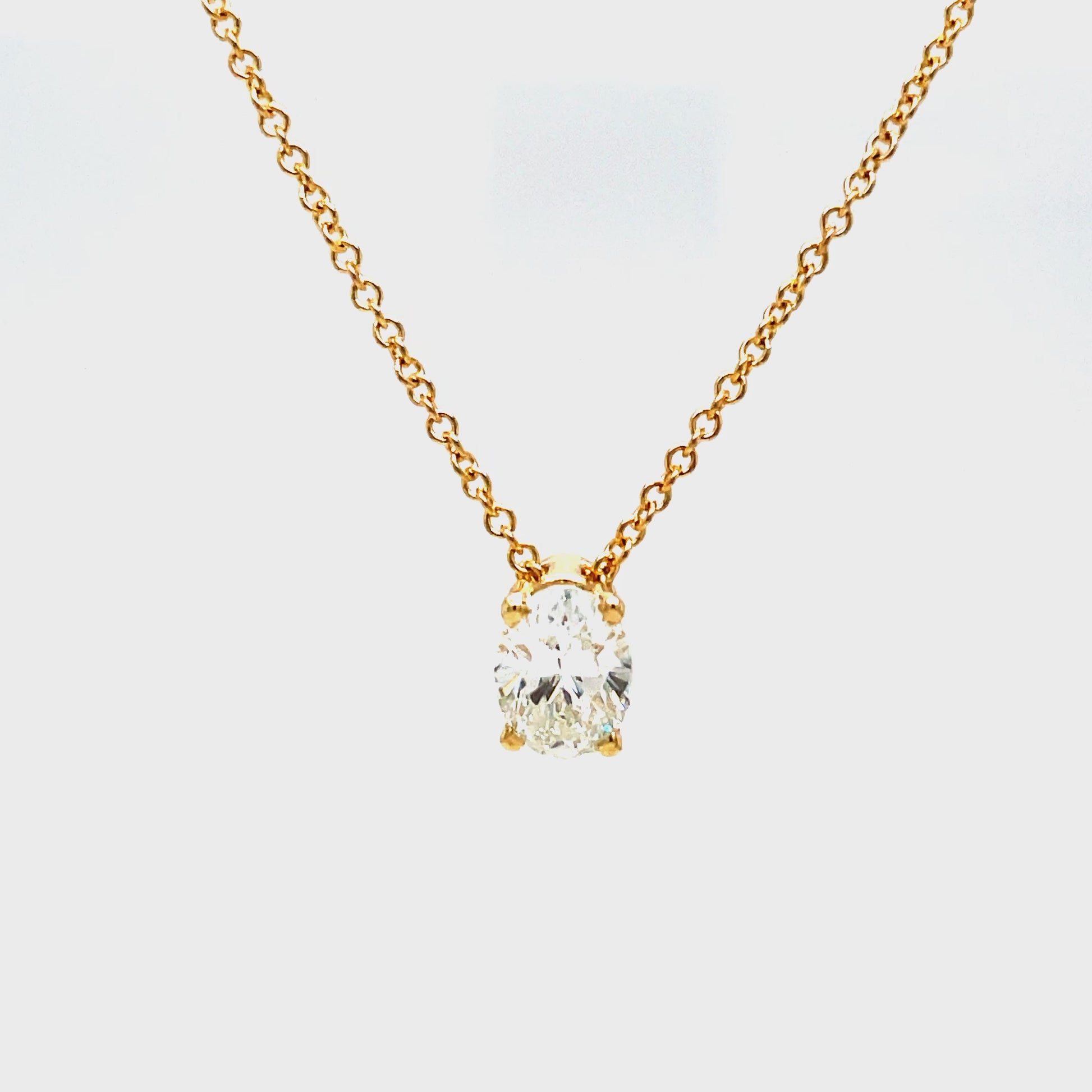 Indulge in understated luxury with our Oval Cut Diamond Solitaire Yellow Gold Necklace. The 1.20 carat oval cut diamond is elegantly set in a secure prong setting, suspended on a 16" yellow gold chain. Perfect for any occasion, this necklace exudes sophistication and grace.