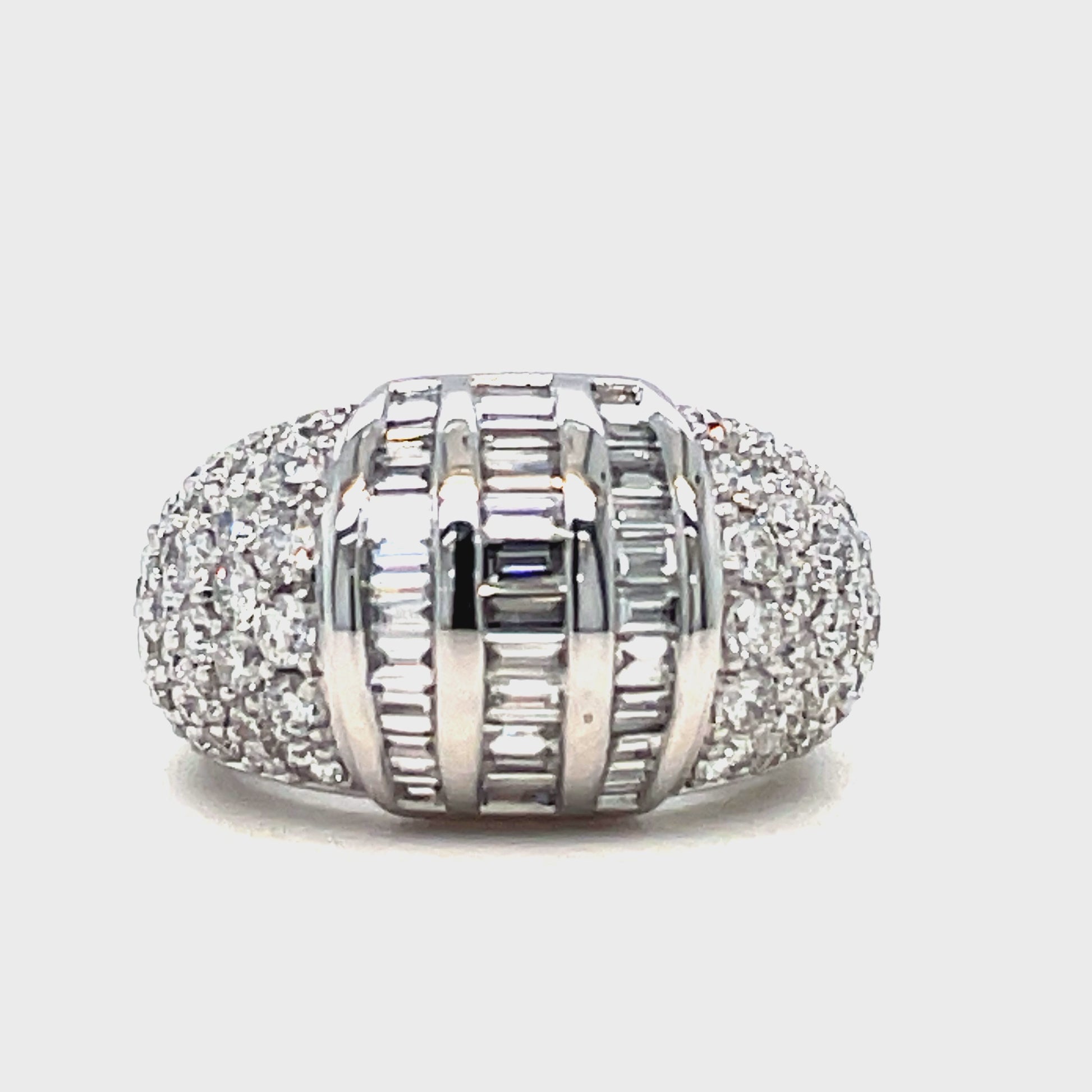 This stunning ring features a combination of round and baguette diamonds totaling 3.20 carats, set in 18k white gold. With a width of 13.00 mm, this ring is sure to make a bold statement. Perfect for those who appreciate classic design and luxurious materials.
