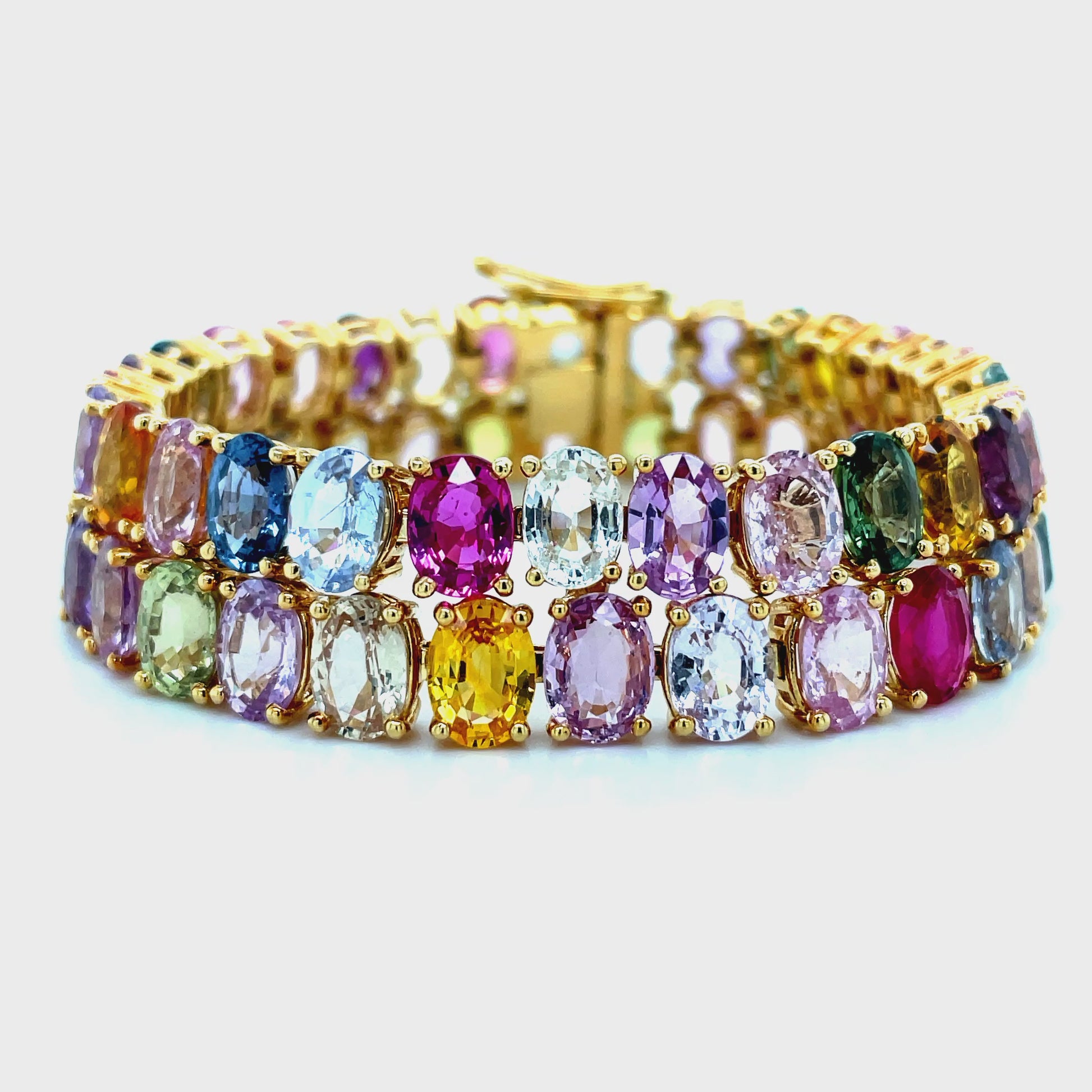 Try on video of 18k Yellow Gold Double Row Multicolor Oval Shape Sapphire Bracelet