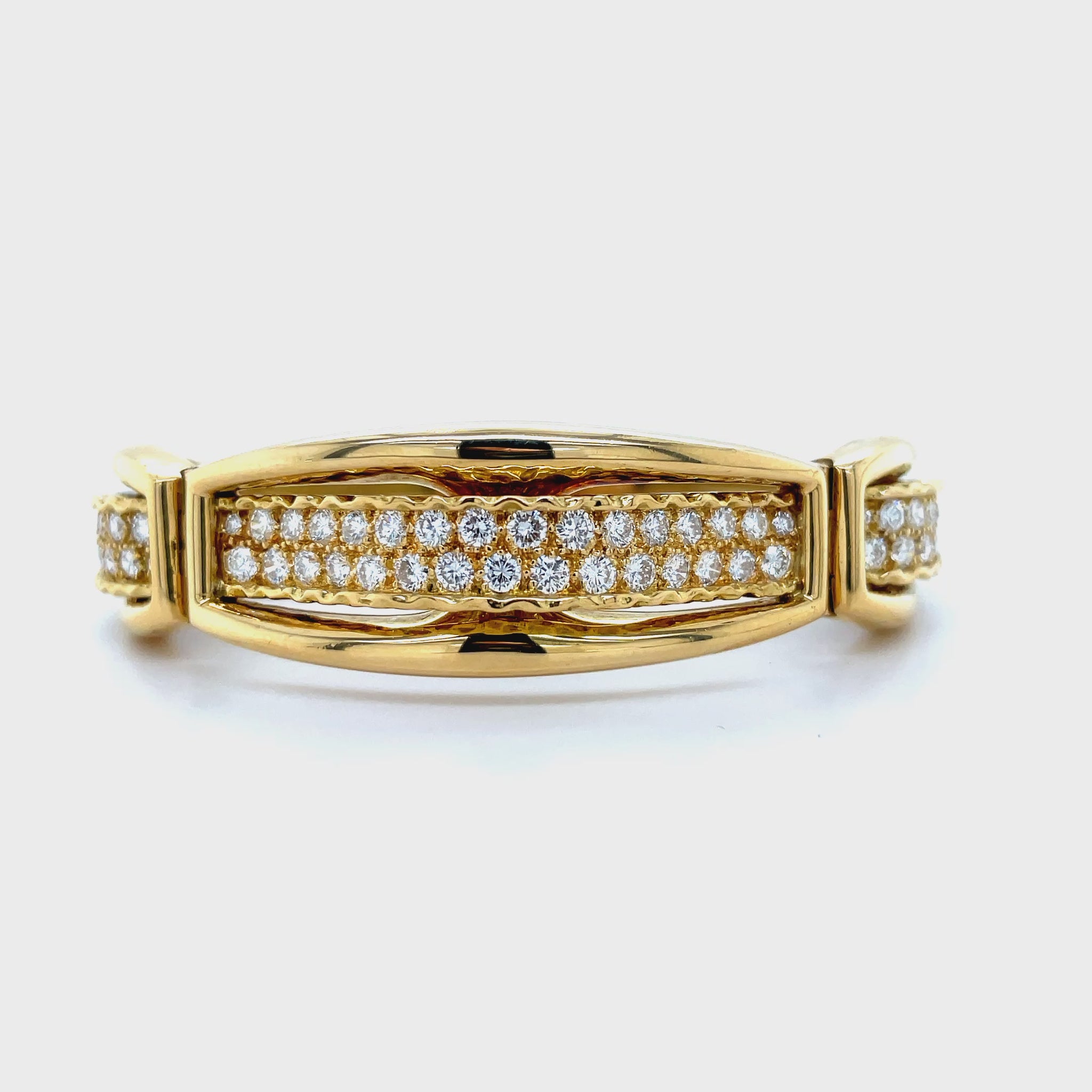 ndulge in luxury with our Graduated Diamond Bangle in 18K Yellow Gold. Adorned with 3.00 carats of sparkling round diamonds, this three tier style bangle exudes elegance and sophistication. With a hinged system, this bangle is not only stunning but also comfortable to wear, making it the perfect accessory for any occasion.