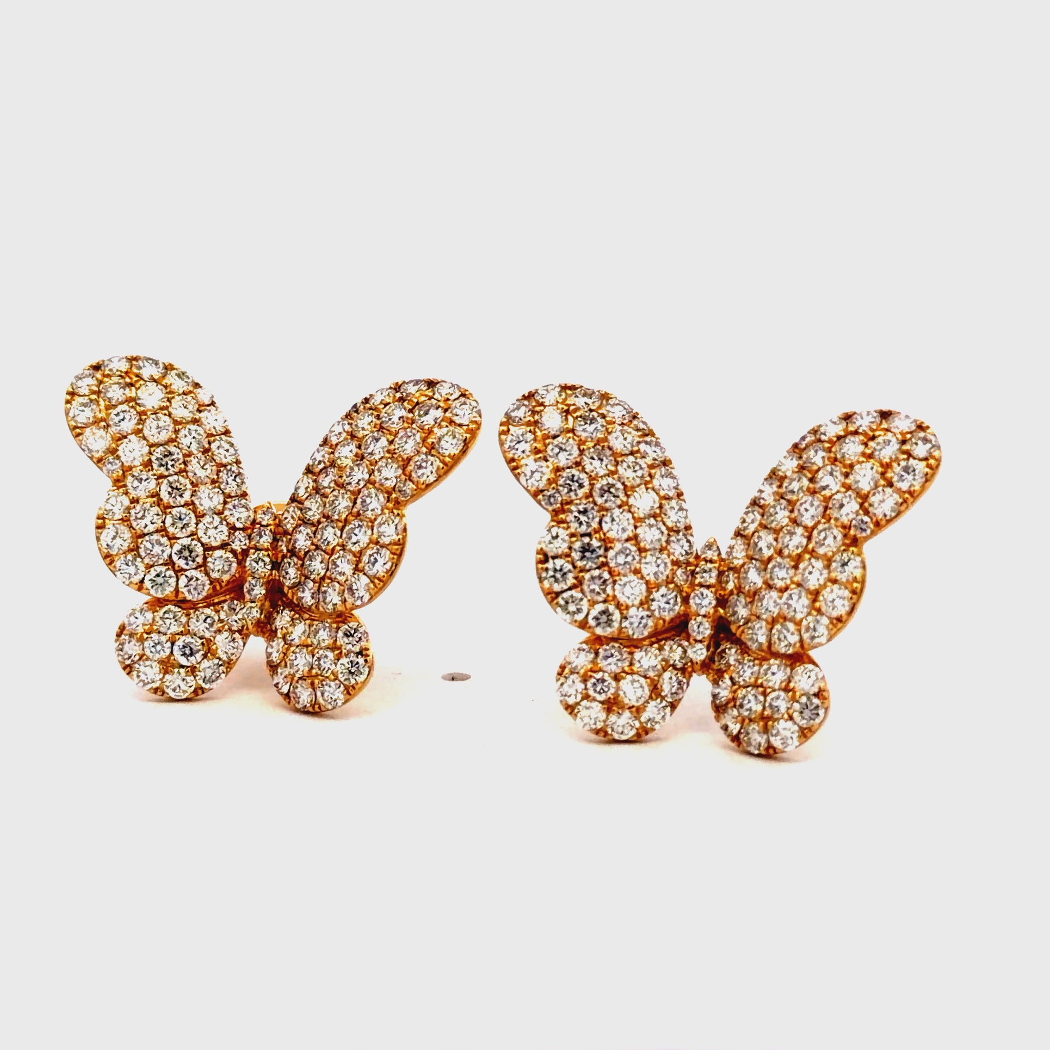 Try on video of 18K Yellow Gold Diamond Pave Butterfly Stud Earrings
