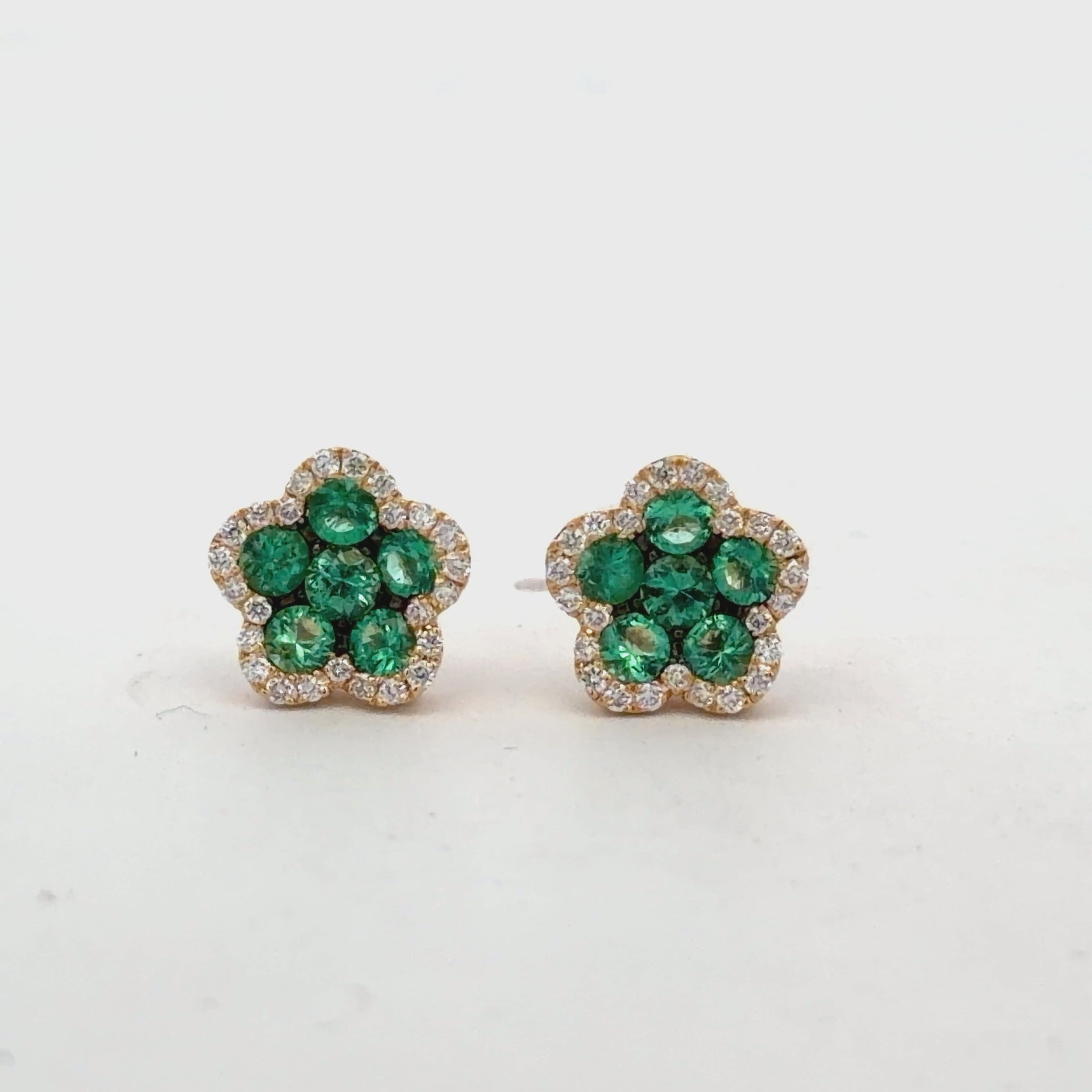 Try on view of 18k Yellow Gold Flower Shape Emerald & Diamond Stud Earrings 