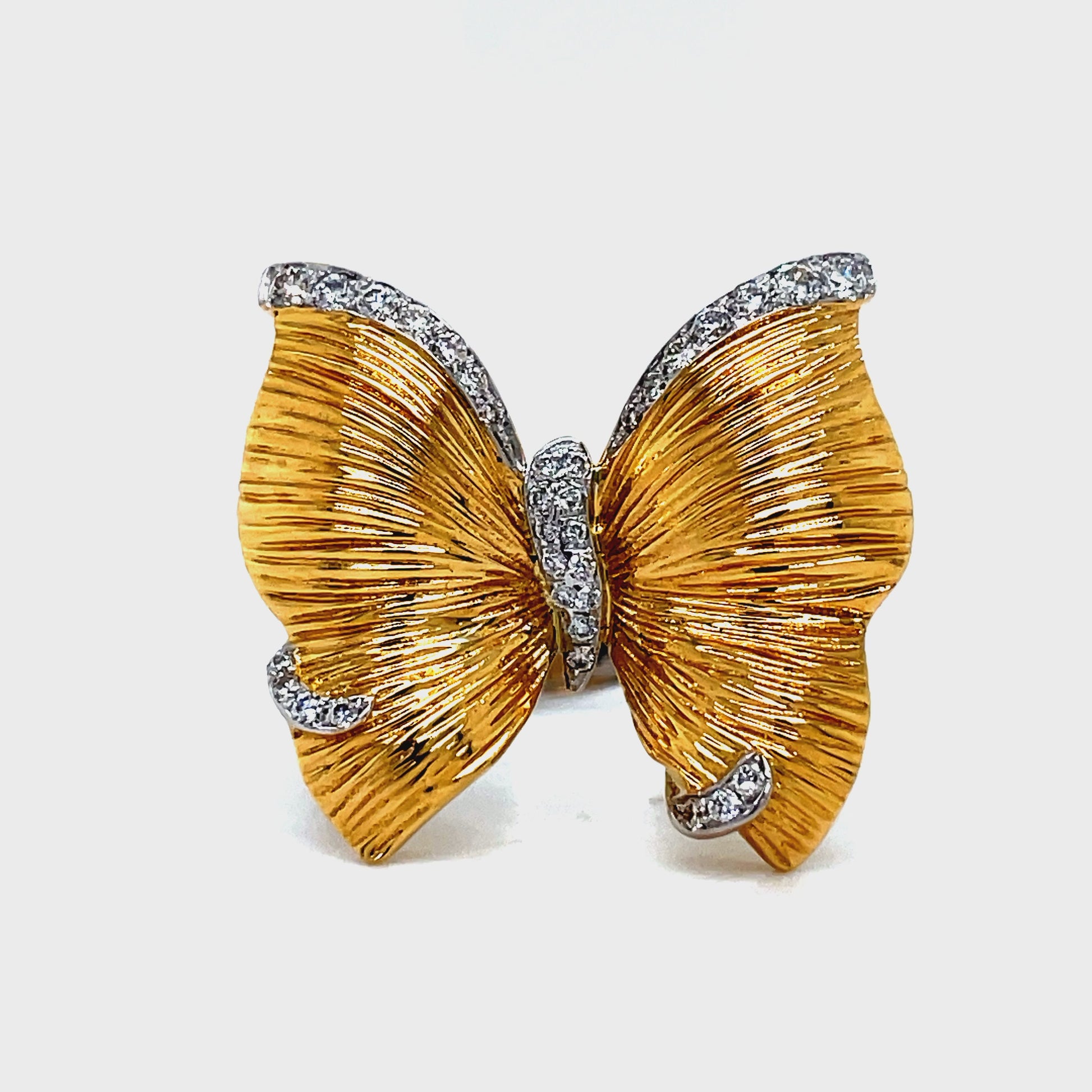 ndulge in elegance with our Butterfly Diamond Ring. Handcrafted with 18k two tone gold, the matte finish adds a unique touch. Sparkling round diamonds totaling 0.22 cts adorn this 19.00 mm ring, making it an exquisite addition to any collection. Make a statement with this exclusive piece.
