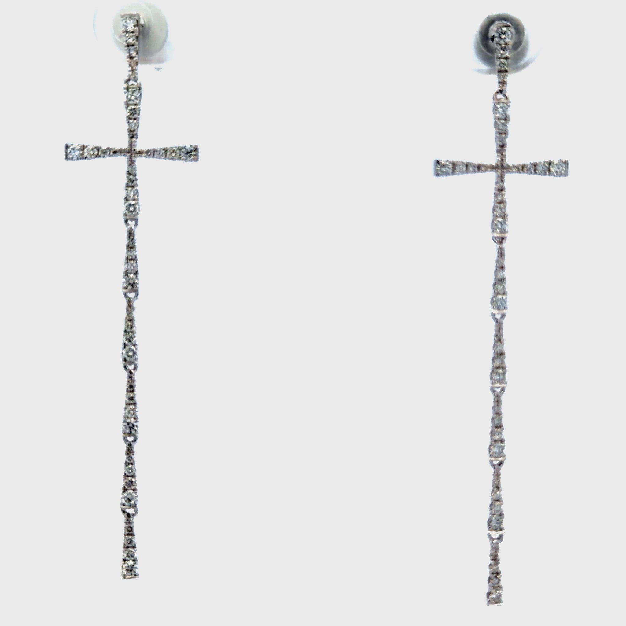 Try on view of 14k Diamond Cross Dangle Earrings in White Gold