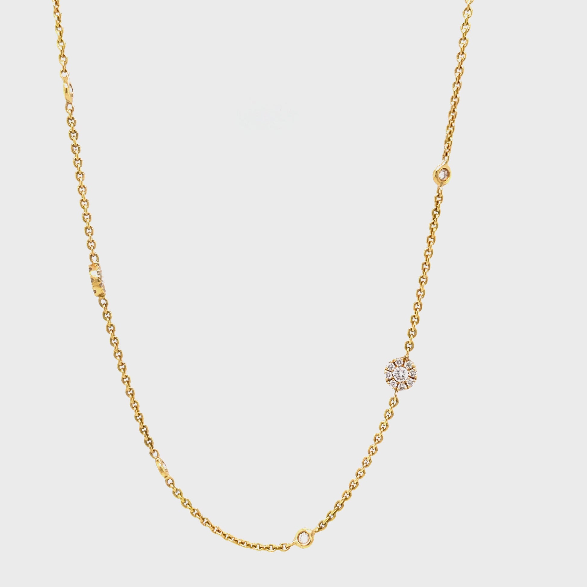 "Shimmer and shine with our Diamond Rondelle Necklace! This stunning piece features 1.00 cts of sparkling diamonds, all set in 16 beautiful 18k yellow gold halo. The 18" chain adds a touch of elegance to complete this luxurious look. Make a statement of luxury and sophistication with this necklace!"