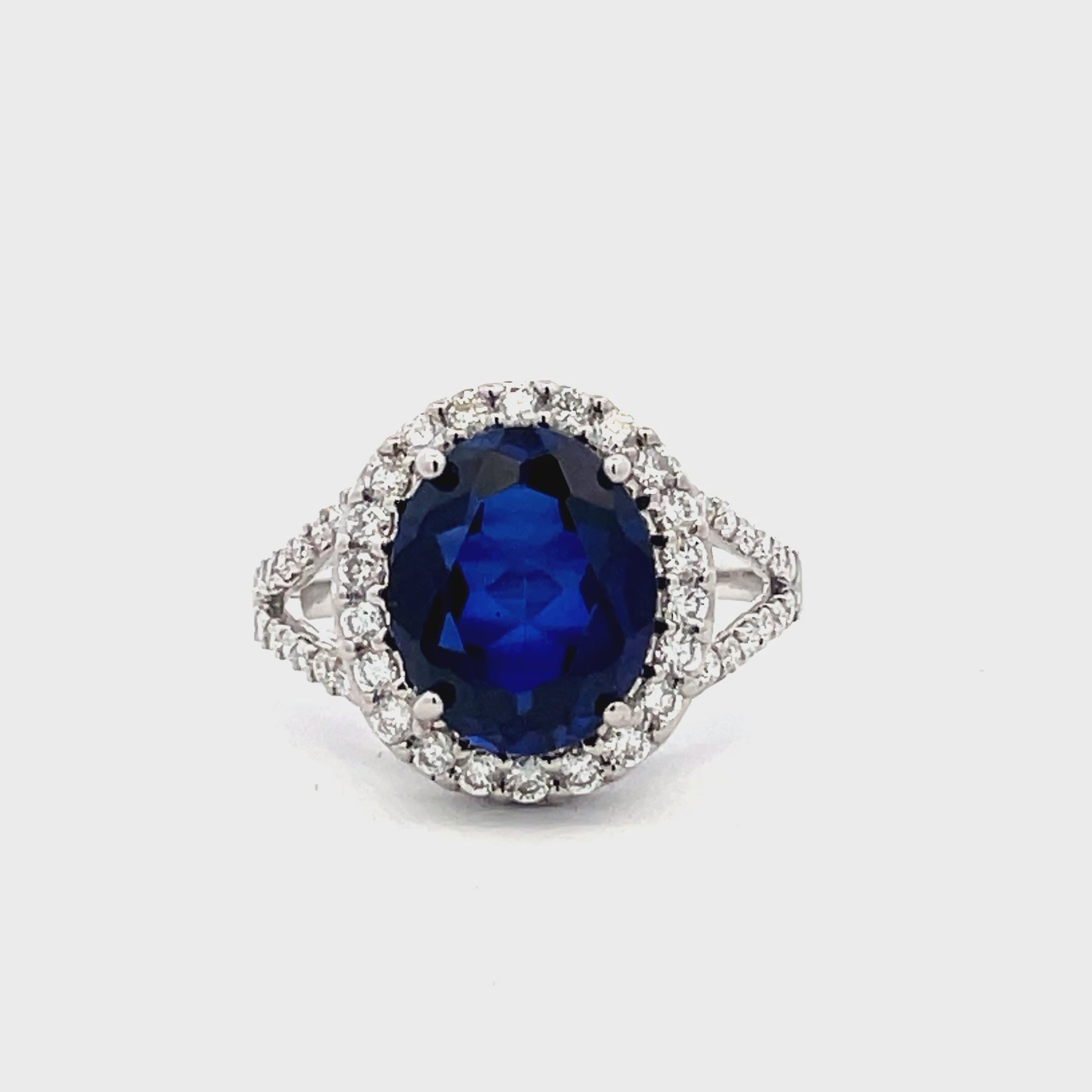 Watch Video of Front and Side View Oval Shape Blue Faceted Sapphire and Diamond Ring