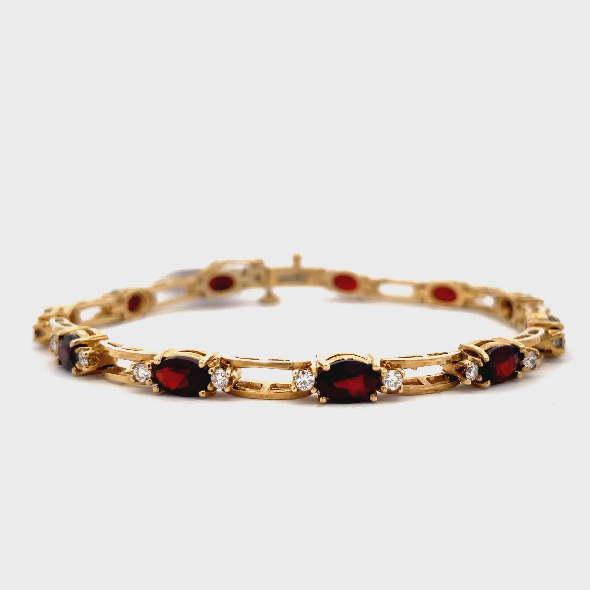Try on video on Estate 14k Yellow Gold Garnet and Diamond Line Bracelet 