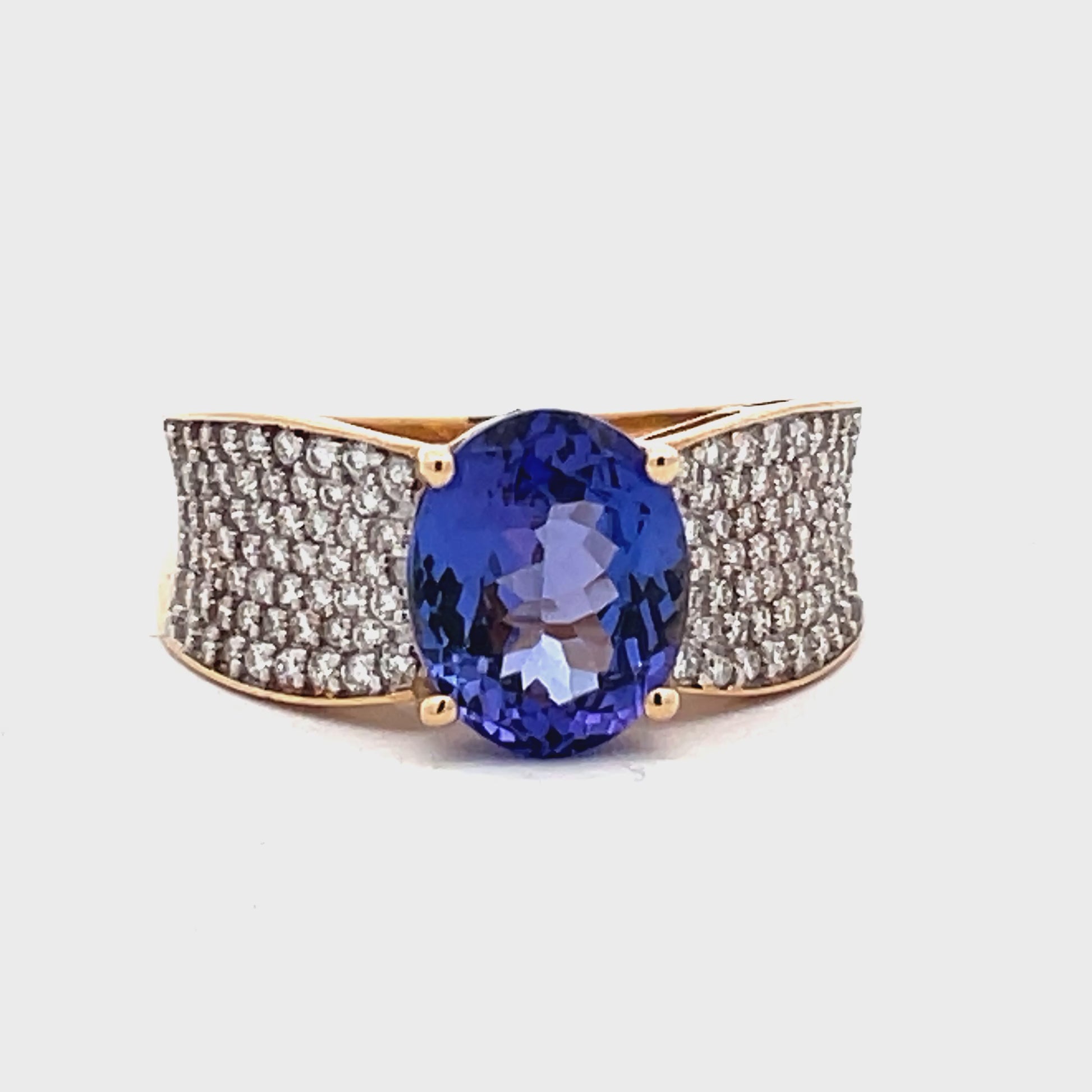 Try on view of Estate 14k Yellow Gold Oval Tanzanite Pave Diamond Ring 
