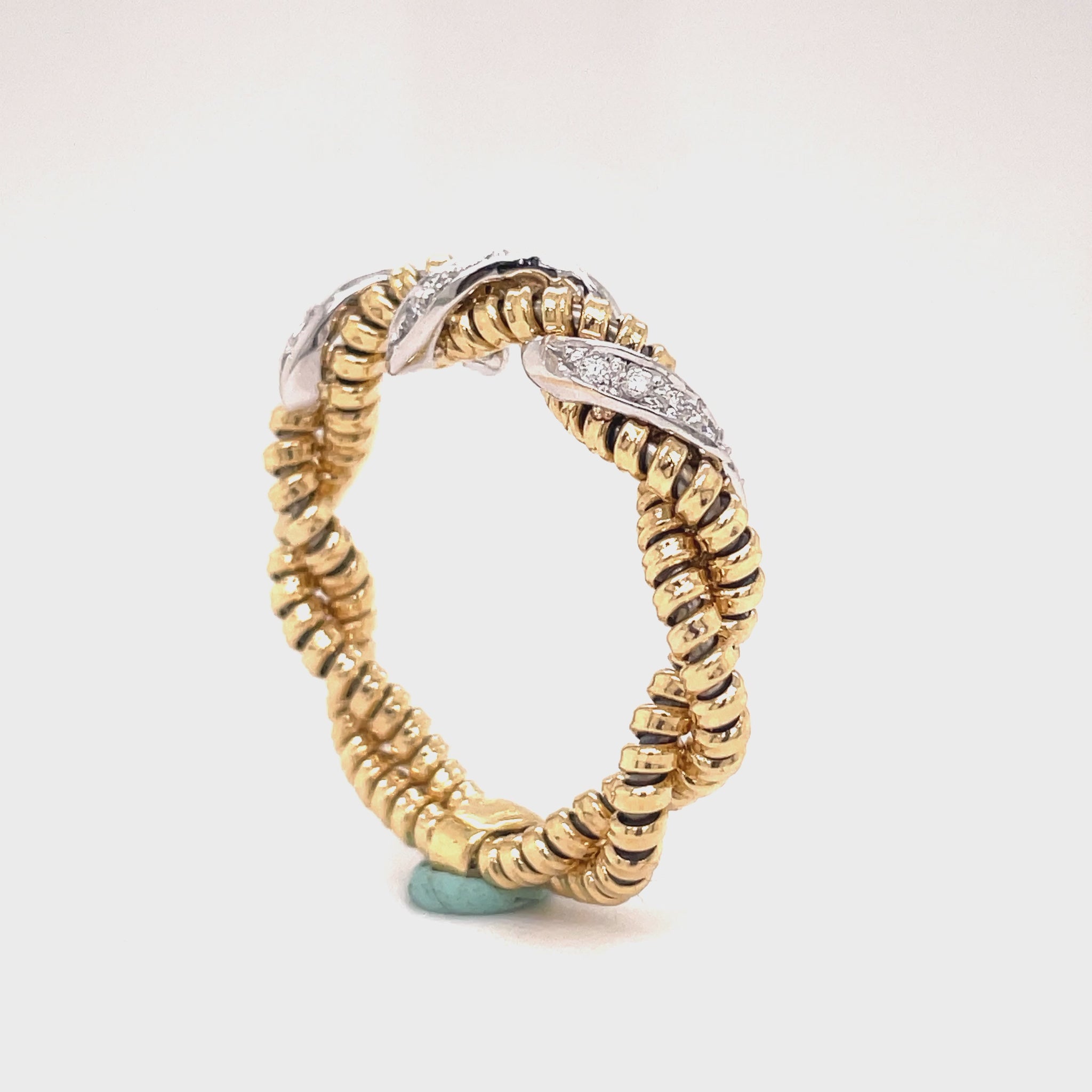 ndulge in luxury with the Italian Gold & Diamond Flexible Ring. From the exquisite Italian designer Novecentonovantanove, this ring features an innovated tubogas technique that allows for flexibility and comfort. With a classic and contemporary design, this 6.00 mm wide ring boasts round diamonds totaling 0.18 carats. Available in size 6.5 and sizeable for the perfect fit. Elevate your style with this sophisticated and exclusive piece