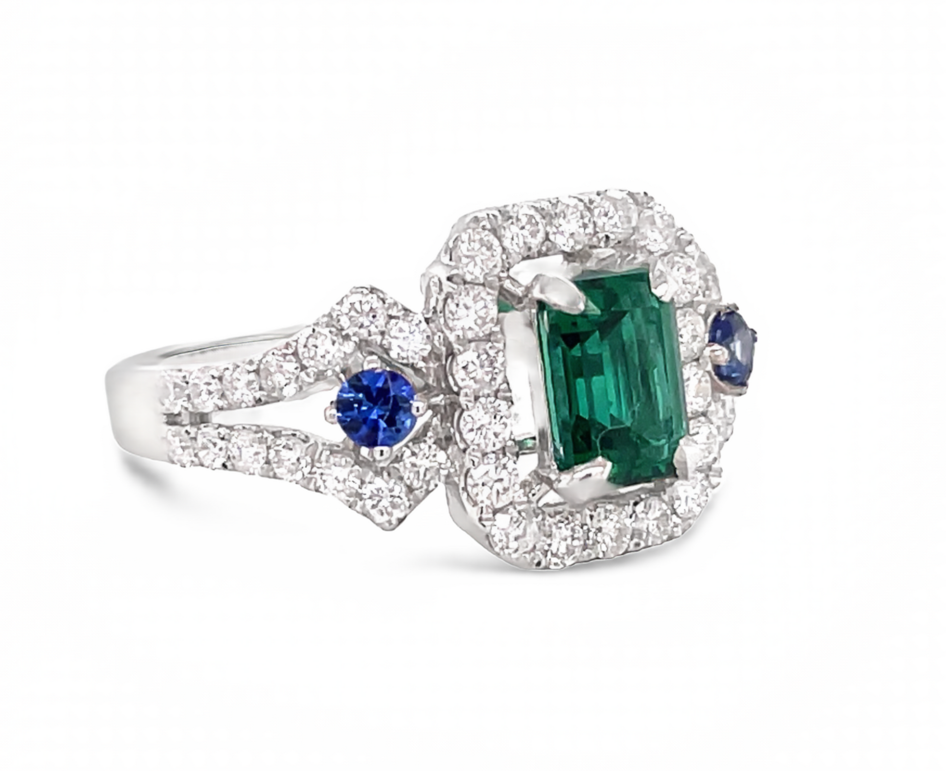 Side view of 18k White Gold Emerald Cut emerald with Diamond Halo & Sapphire Ring