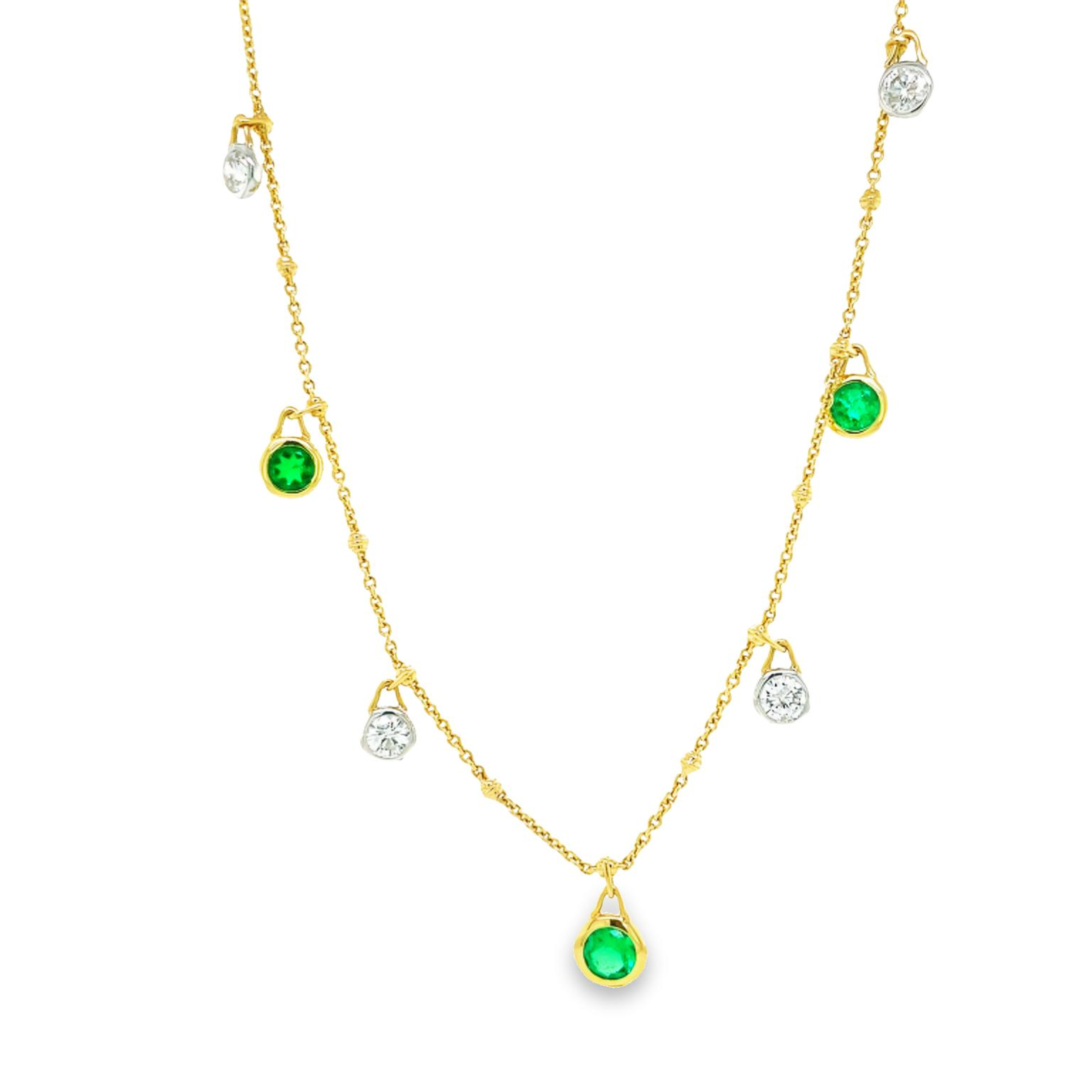 Unique style  5 round emeralds 1.40 cts  Great hue color  5 round diamonds 1.10 cts  F/G color  Set in 18 yellow gold  Secure lobster clasp  18" long