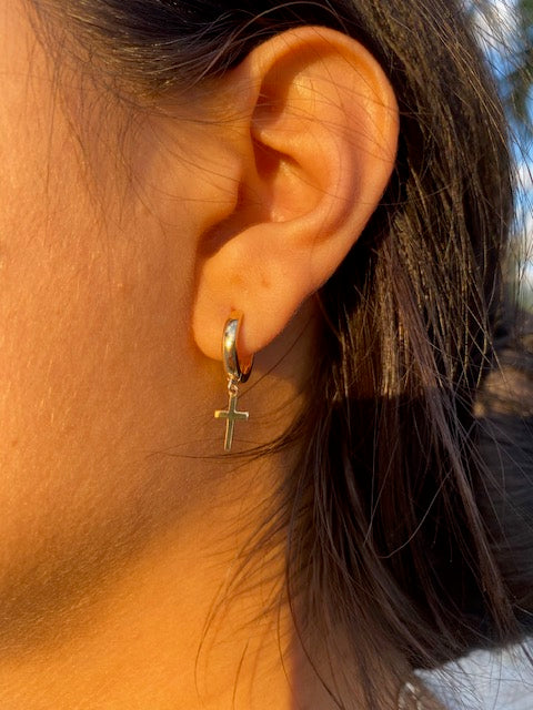 Try on view of 14k Yellow Gold Dainty Dangling Cross Earrings