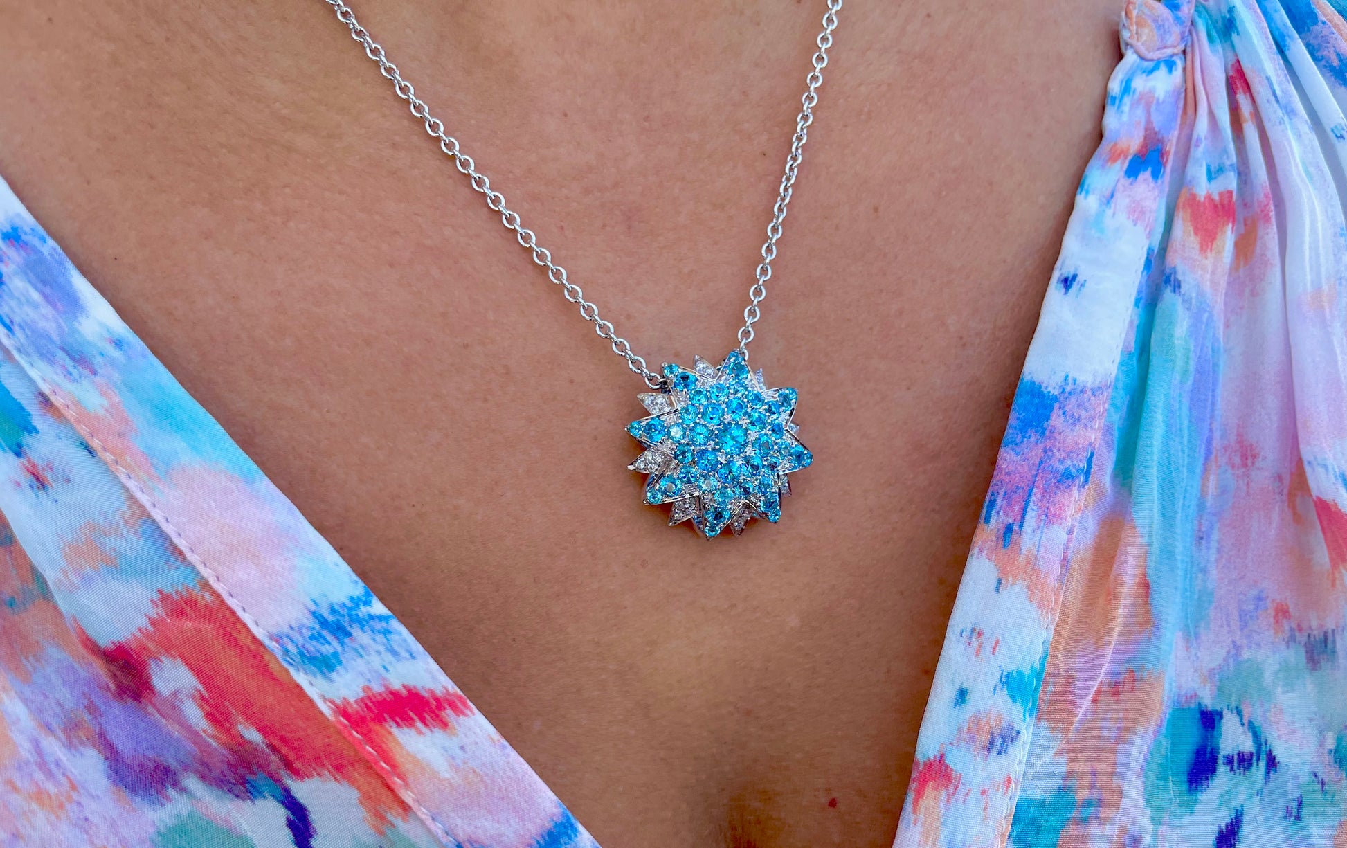 Try on view of 18k White Gold Italian Made Sunburst Blue Topaz & Diamond Necklace