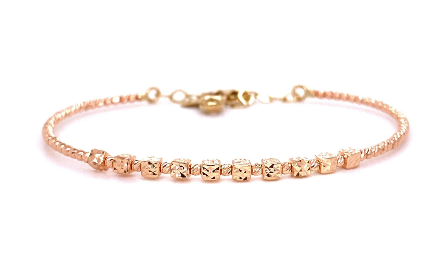 Front view of fastened 14k Rose Gold Gold Diamond Cut Bangle