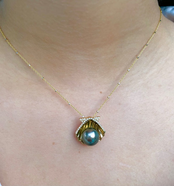 Try on view of 14k Yellow Gold Tahitian Pearl & Diamond Sunrise Shell Pendant Necklace