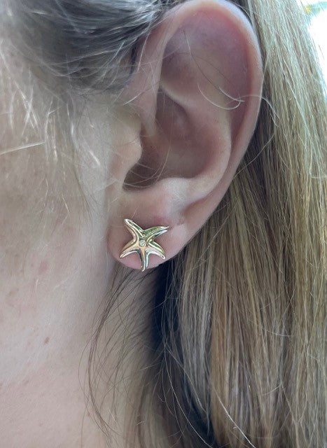 Try on view of 14k Yellow Gold Diamond Starfish Earrings